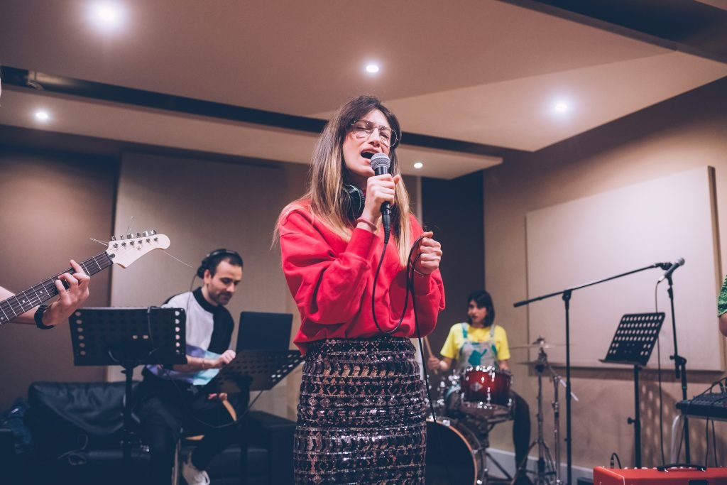 young woman singer rehearsing